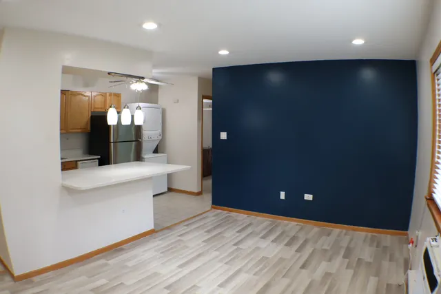 a kitchen with stainless steel appliances a stove and more cabinets