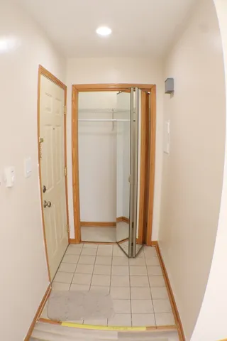 a kitchen with kitchen island a stove a refrigerator and a sink with wooden floor