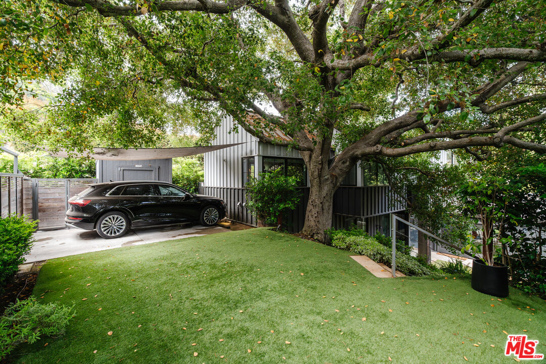 461 West Rustic Road Santa Monica, CA 90402 - Photo 6 of 7 a view of a house with backyard sitting area and garden
