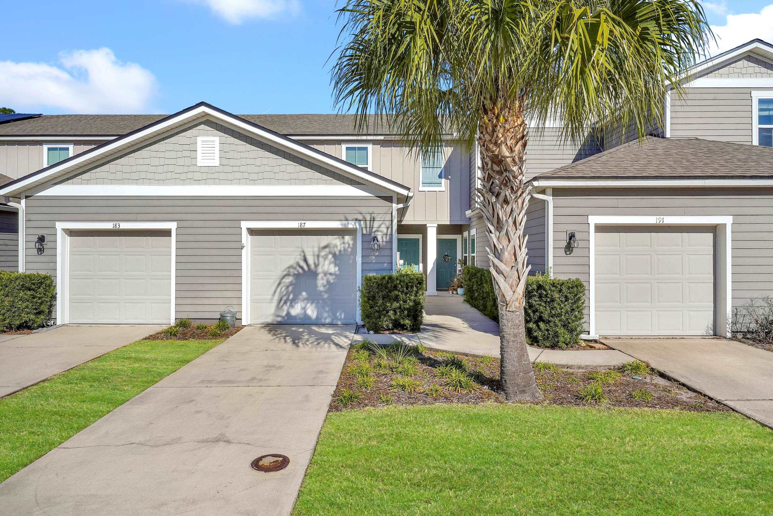 187 Whitland Way St. Augustine, FL 32086 - Photo 1 of 30 a front view of a house with a yard and garage