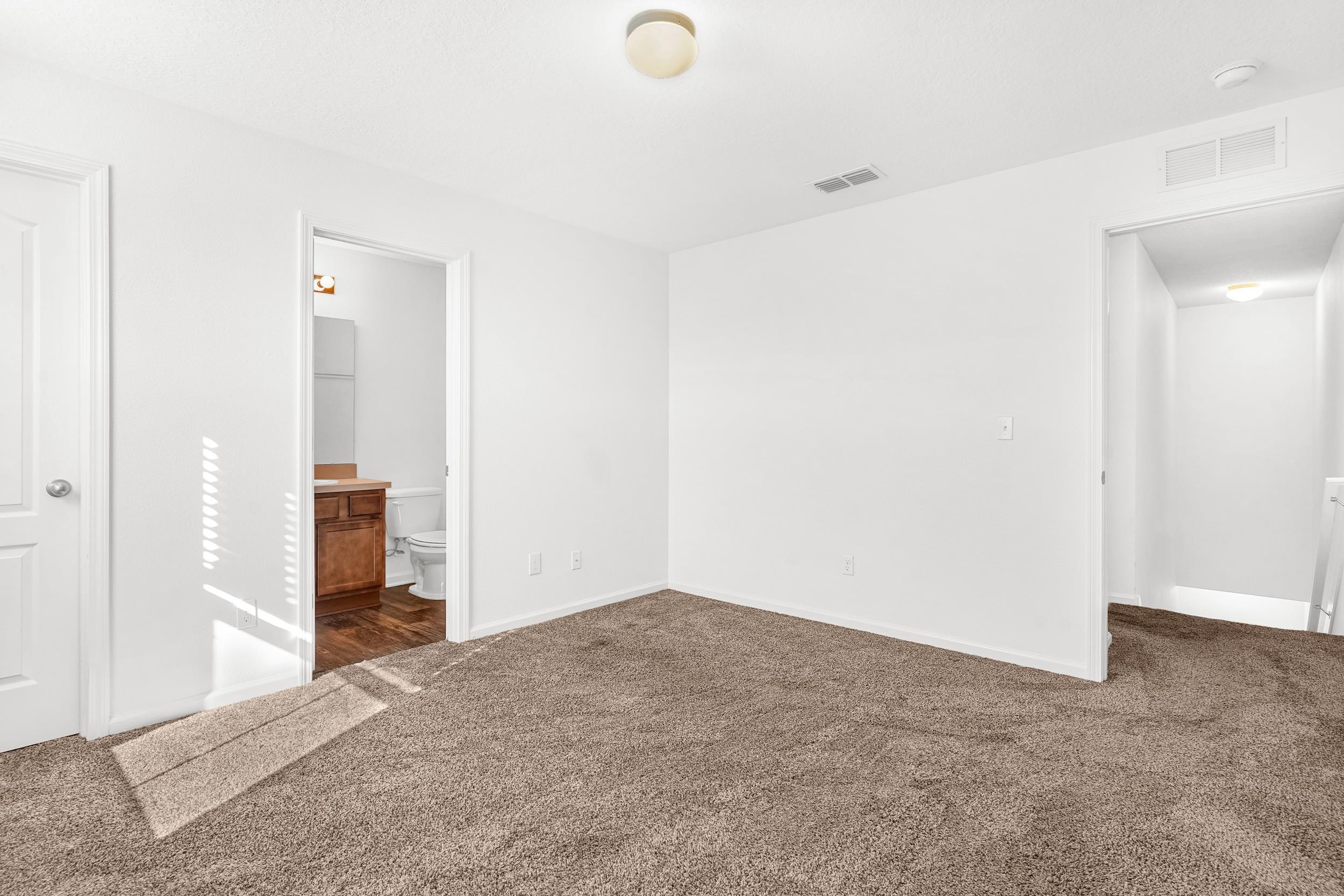 187 Whitland Way St. Augustine, FL 32086 - Photo 16 of 30 an empty room with closet and a bathroom