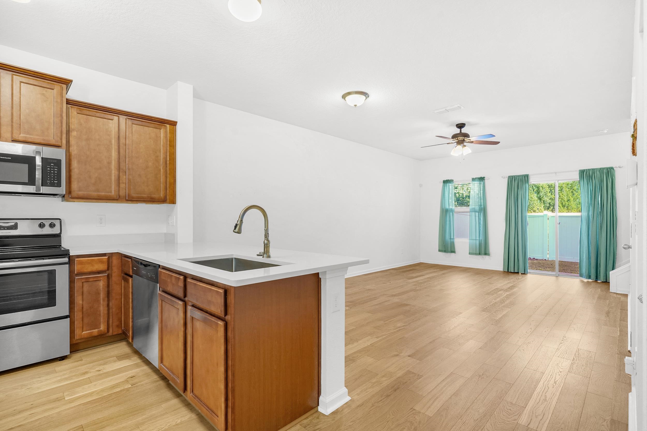187 Whitland Way St. Augustine, FL 32086 - Photo 2 of 30 a kitchen with a sink and cabinets