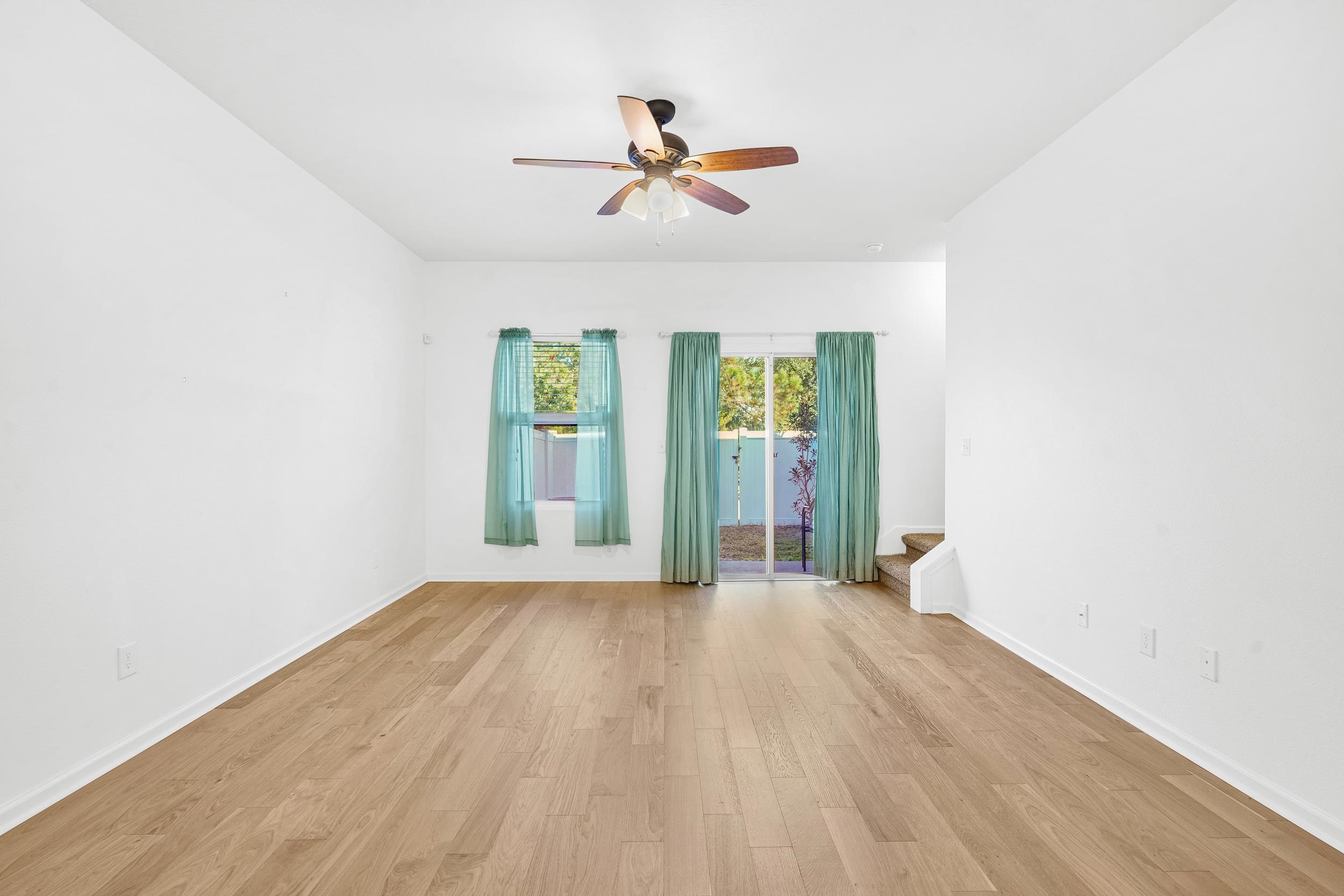 187 Whitland Way St. Augustine, FL 32086 - Photo 6 of 30 wooden floor in an empty room with a window