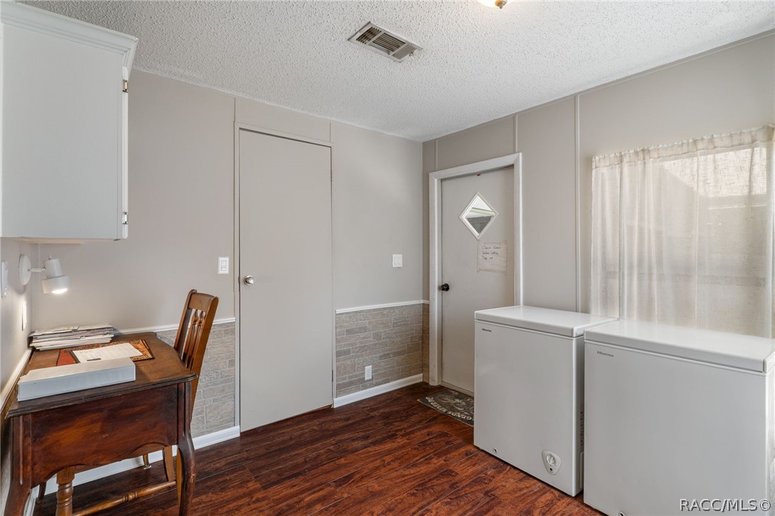 7927 West Cyprian Court Homosassa, FL 34448 - Photo 16 of 40 a view of kitchen with furniture and wooden floor