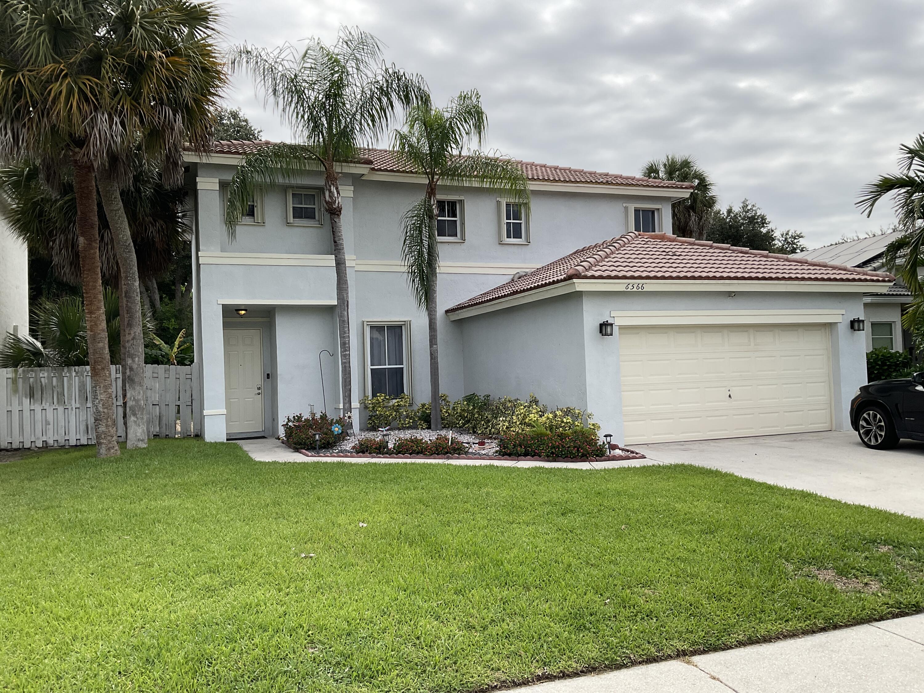6566 Spring Meadow Drive Greenacres, FL 33413 - Photo 1 of 47 EXTERIOR FRONT