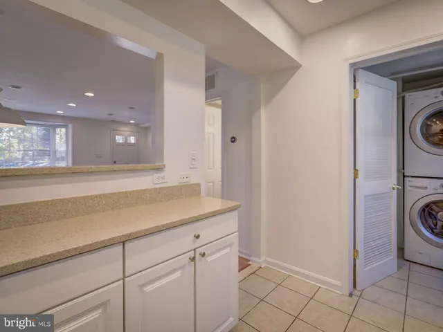 a view of a hallway with washer and dryer