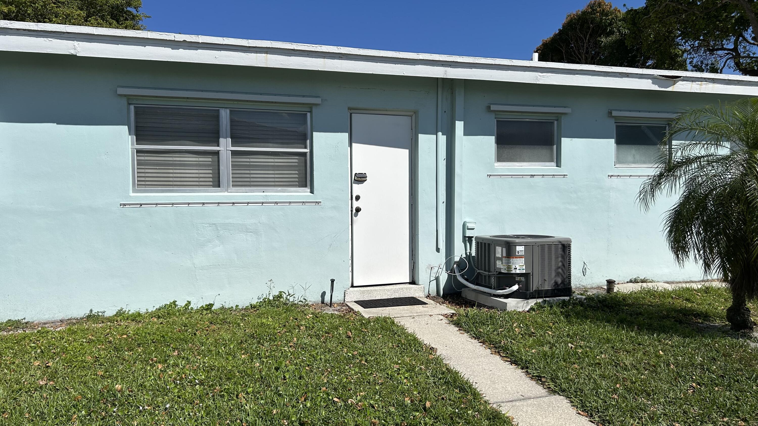 3801 Northeast 22nd Terrace, Unit 5 Lighthouse Point, FL 33064 - Photo 14 of 14 back door from alley enters bedroom