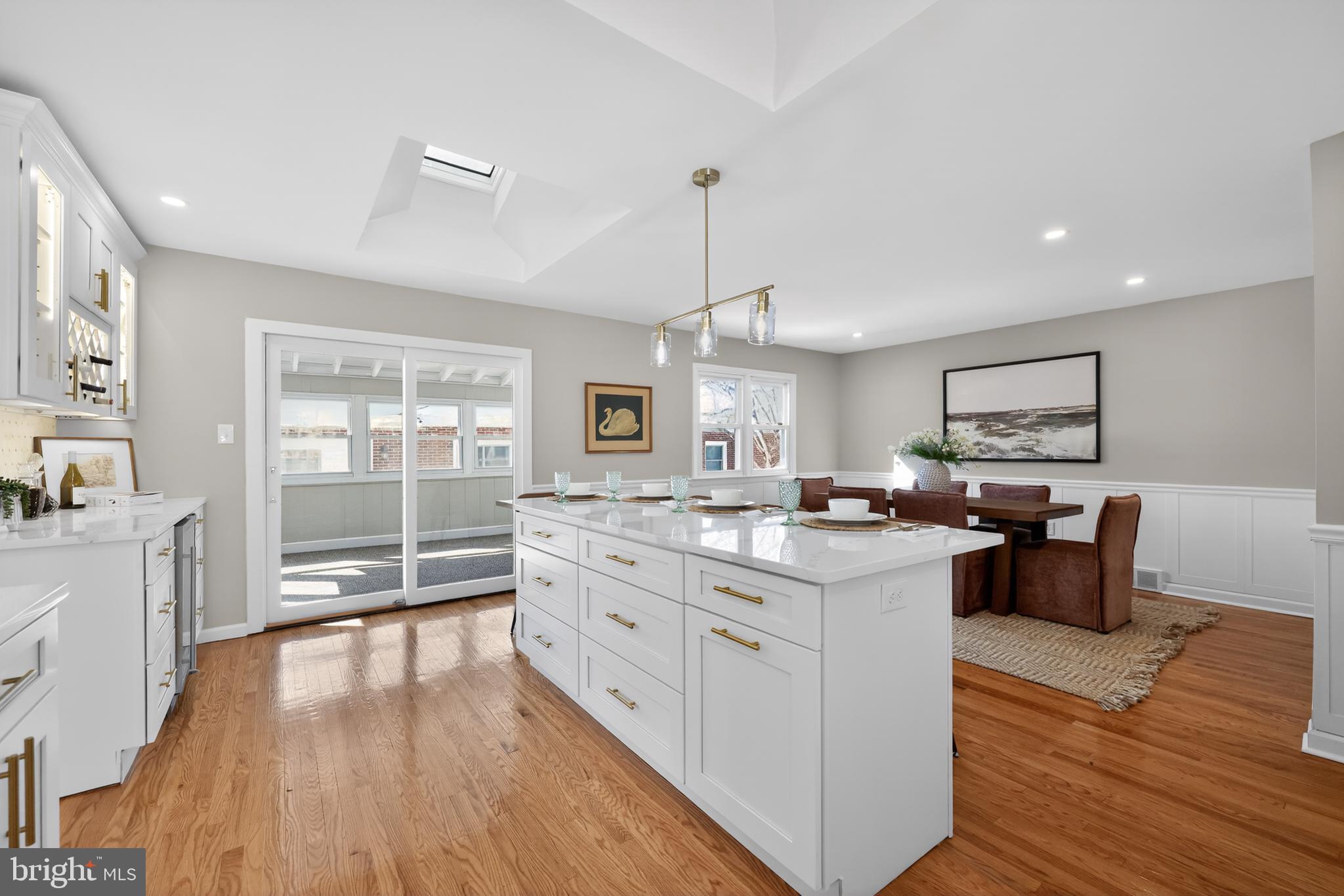 516 Beatty Road Springfield, PA 19064 - Photo 13 of 36 a large kitchen with cabinets wooden floor and stainless steel appliances