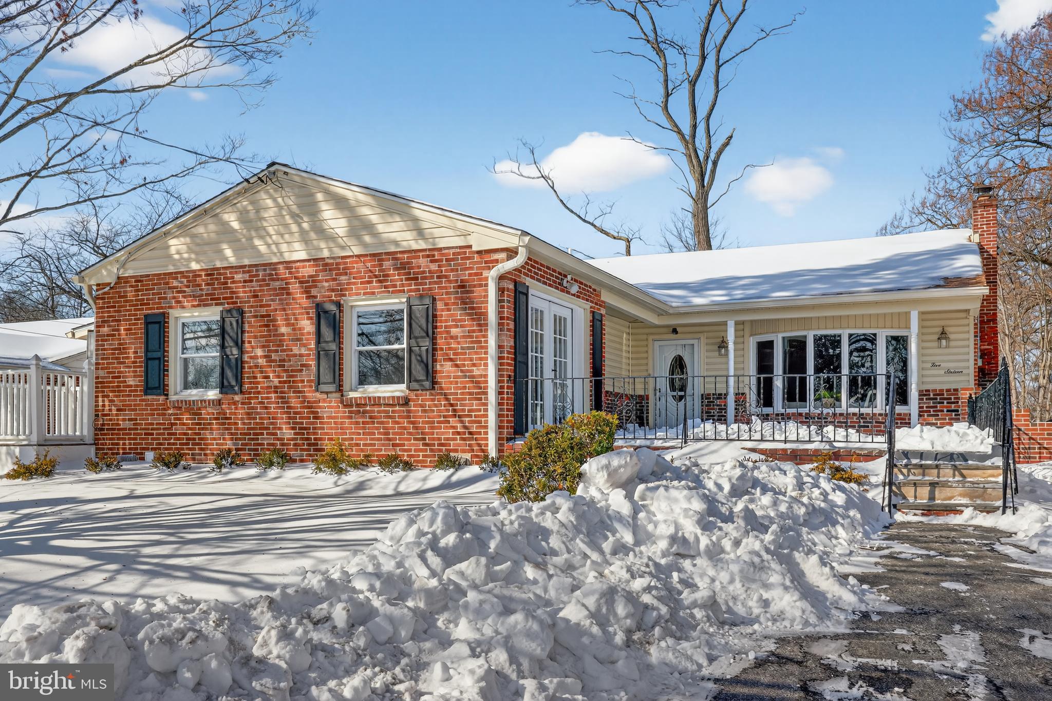 516 Beatty Road Springfield, PA 19064 - Photo 2 of 36 a front view of a house with a yard outdoor seating and covered with trees