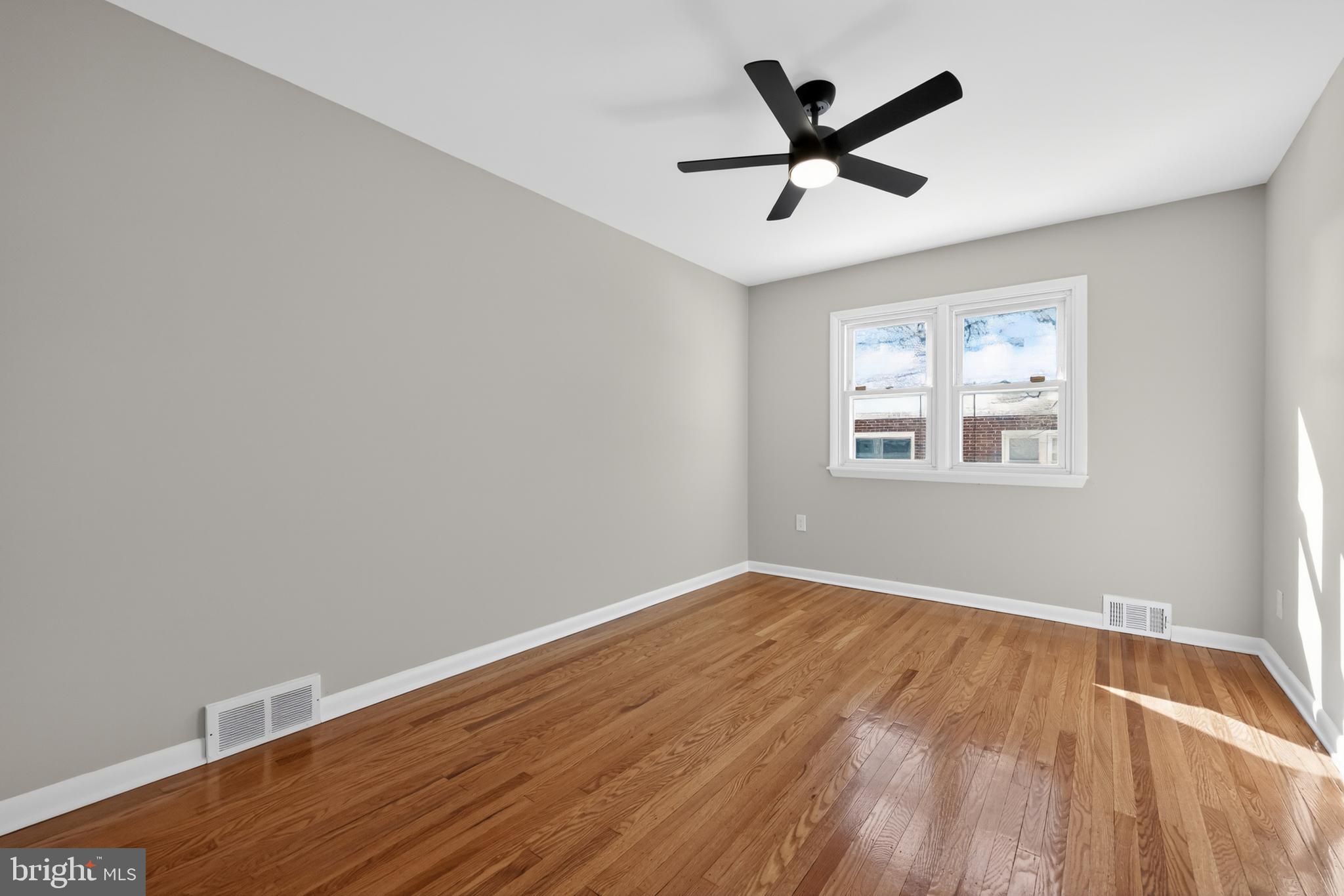 516 Beatty Road Springfield, PA 19064 - Photo 23 of 36 a view of empty room with wooden floor