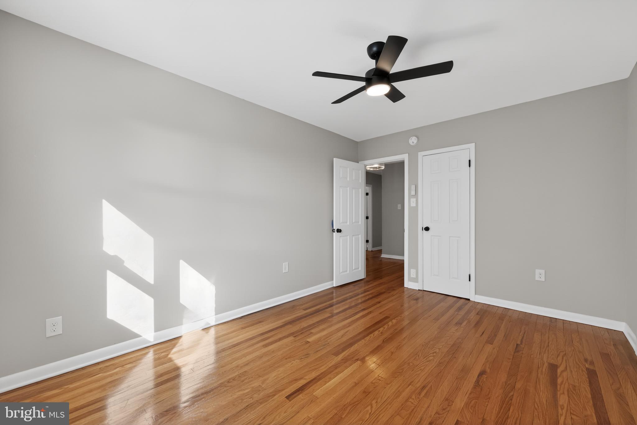 516 Beatty Road Springfield, PA 19064 - Photo 24 of 36 a view of empty room with wooden floor and fan