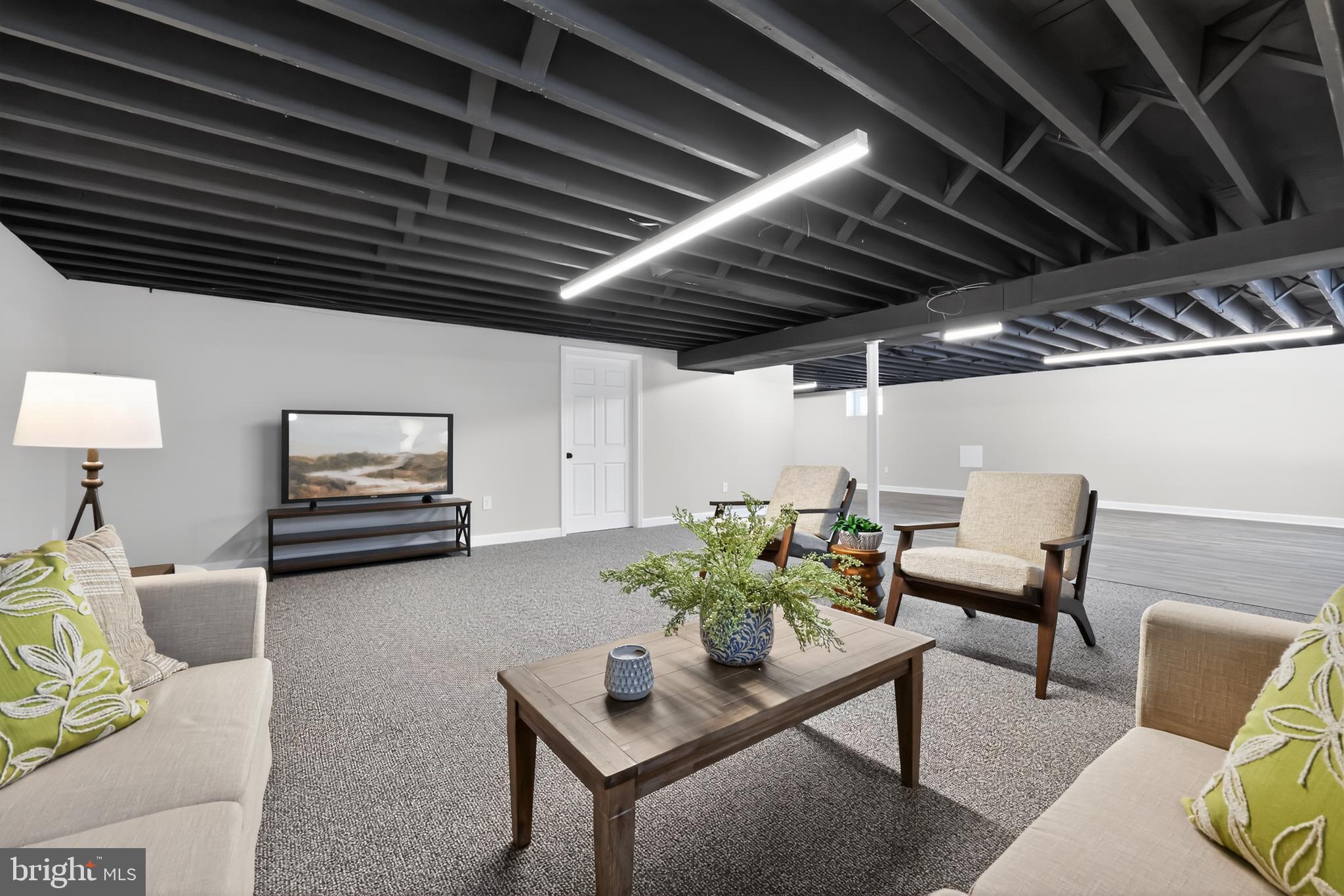 516 Beatty Road Springfield, PA 19064 - Photo 29 of 36 a living room with furniture and a wooden floor