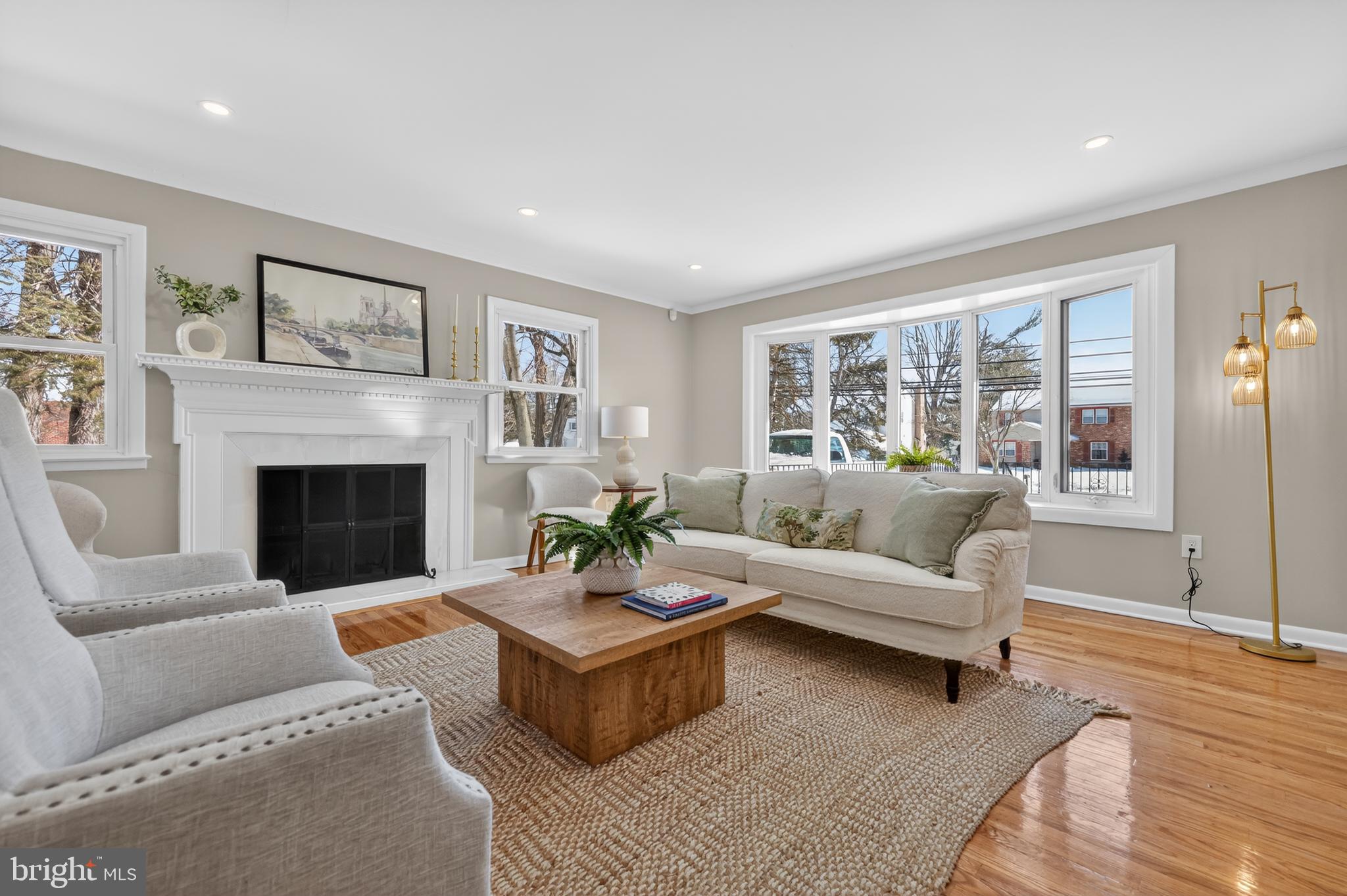 516 Beatty Road Springfield, PA 19064 - Photo 6 of 36 a living room with furniture a large window and a fireplace