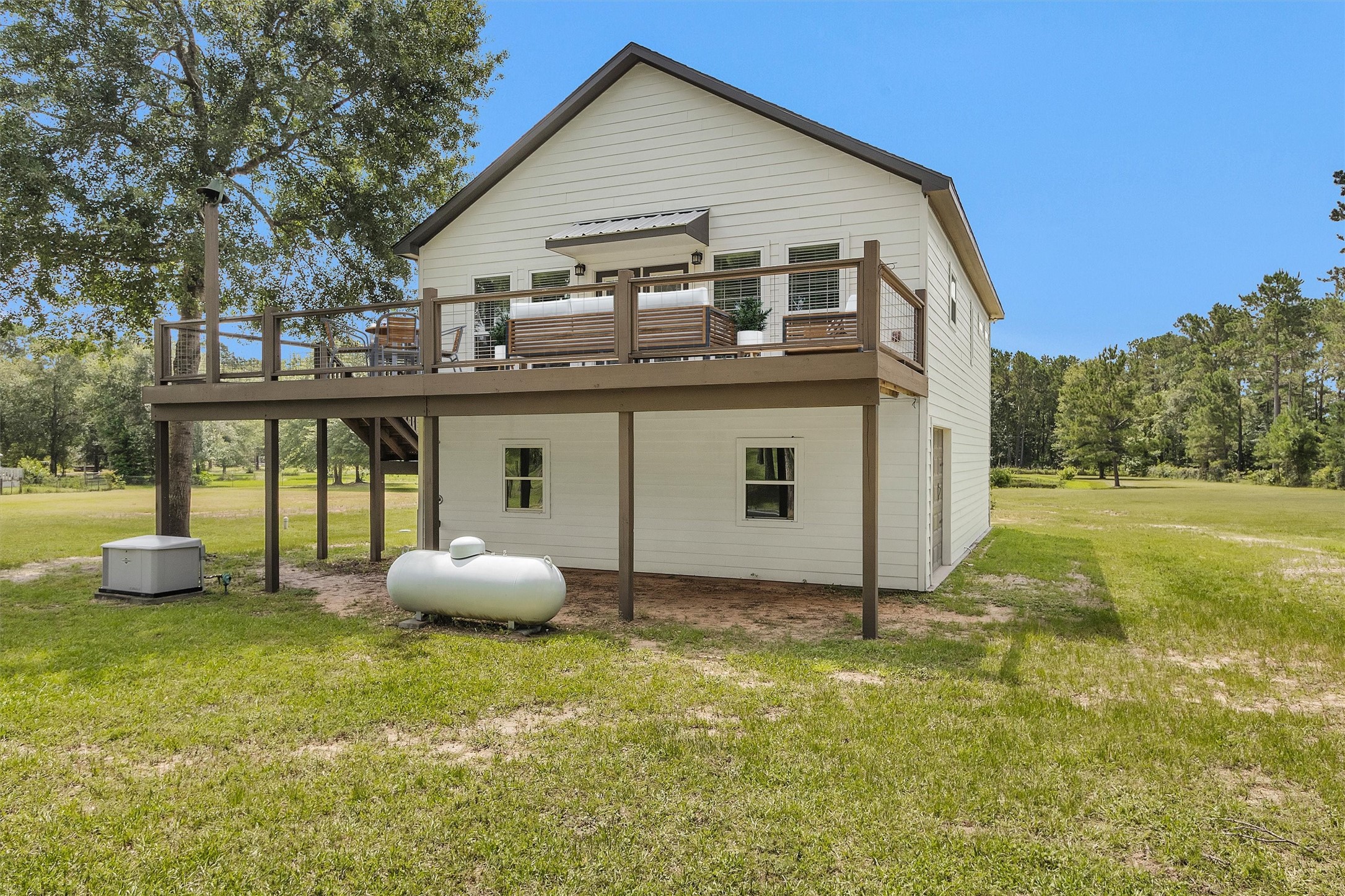 9321 North Walker Road Cleveland, TX 77328 - Photo 10 of 49 Whole Home Generator added in 2021 & 250 Gallon Propane Tank & Outdoor Shower