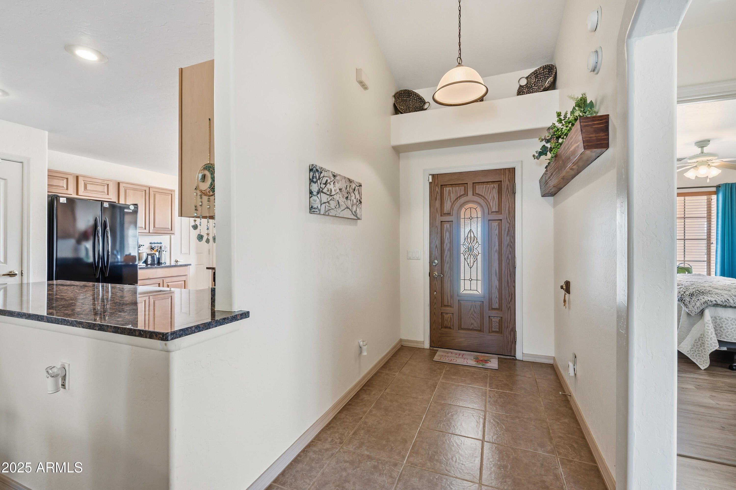 14844 South Brook Hollow Road Arizona City, AZ 85123 - Photo 9 of 35 a view of a hallway view with furniture and wooden floor