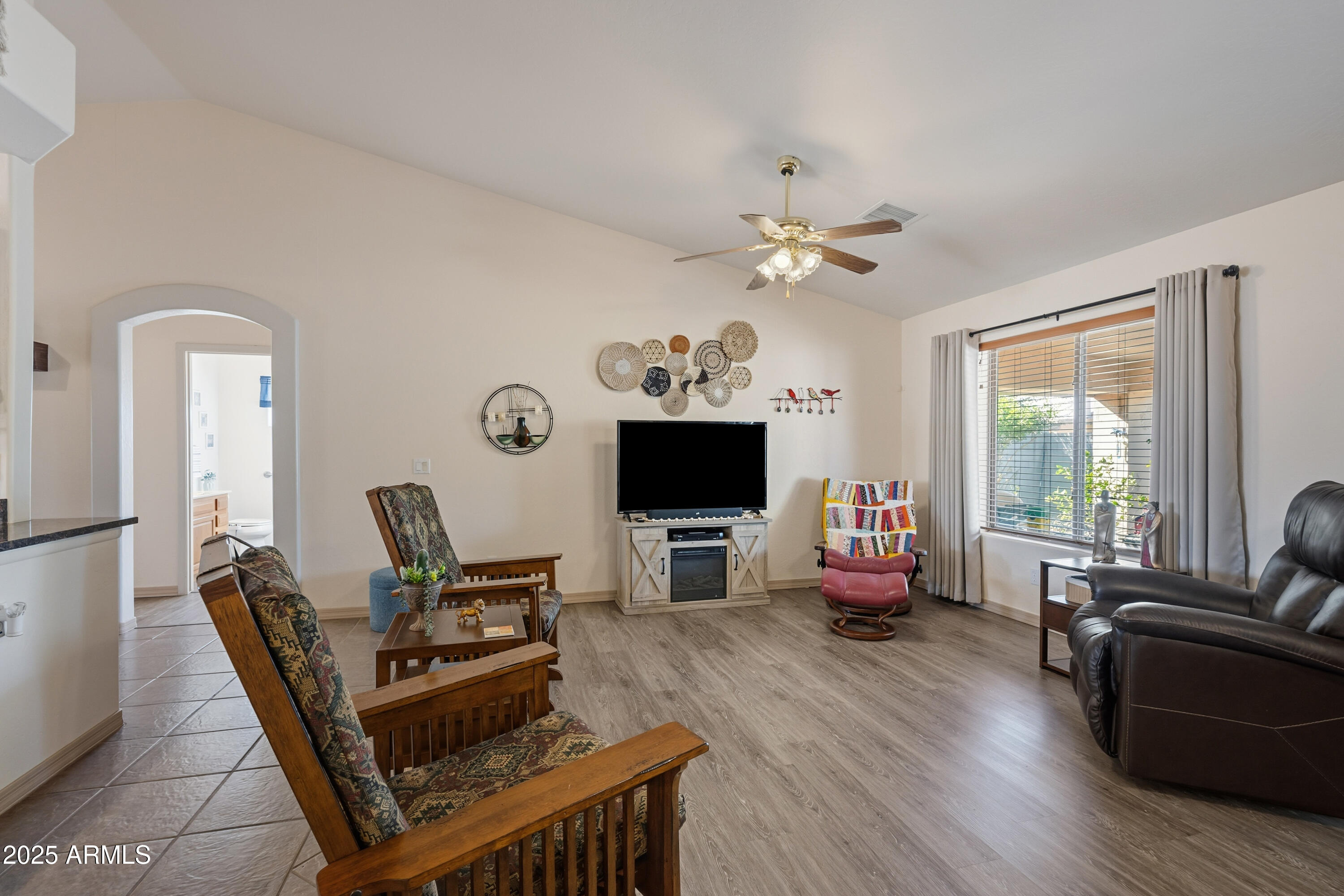 14844 South Brook Hollow Road Arizona City, AZ 85123 - Photo 11 of 35 a living room with furniture and a flat screen tv