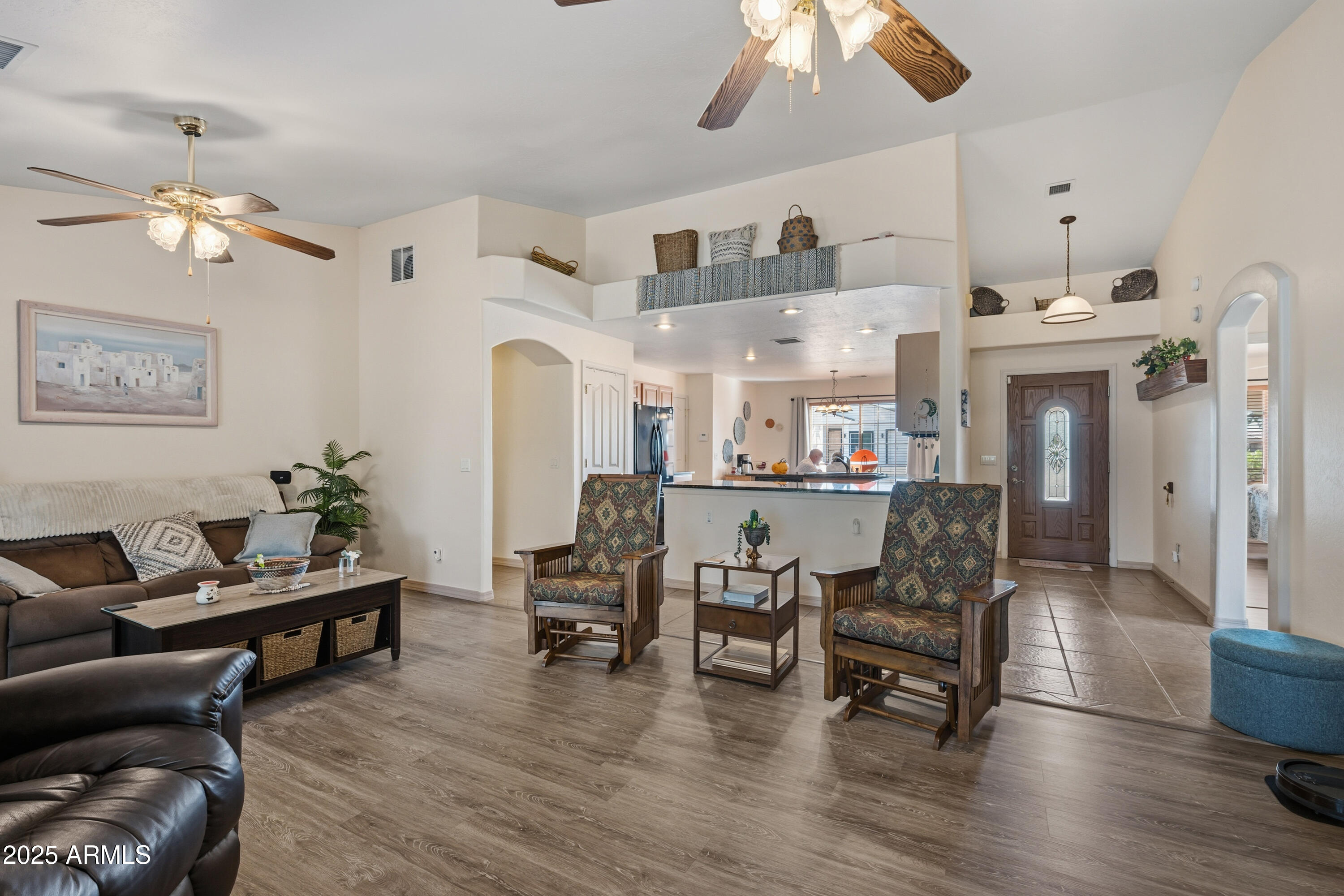14844 South Brook Hollow Road Arizona City, AZ 85123 - Photo 13 of 35 a living room with furniture and a chandelier
