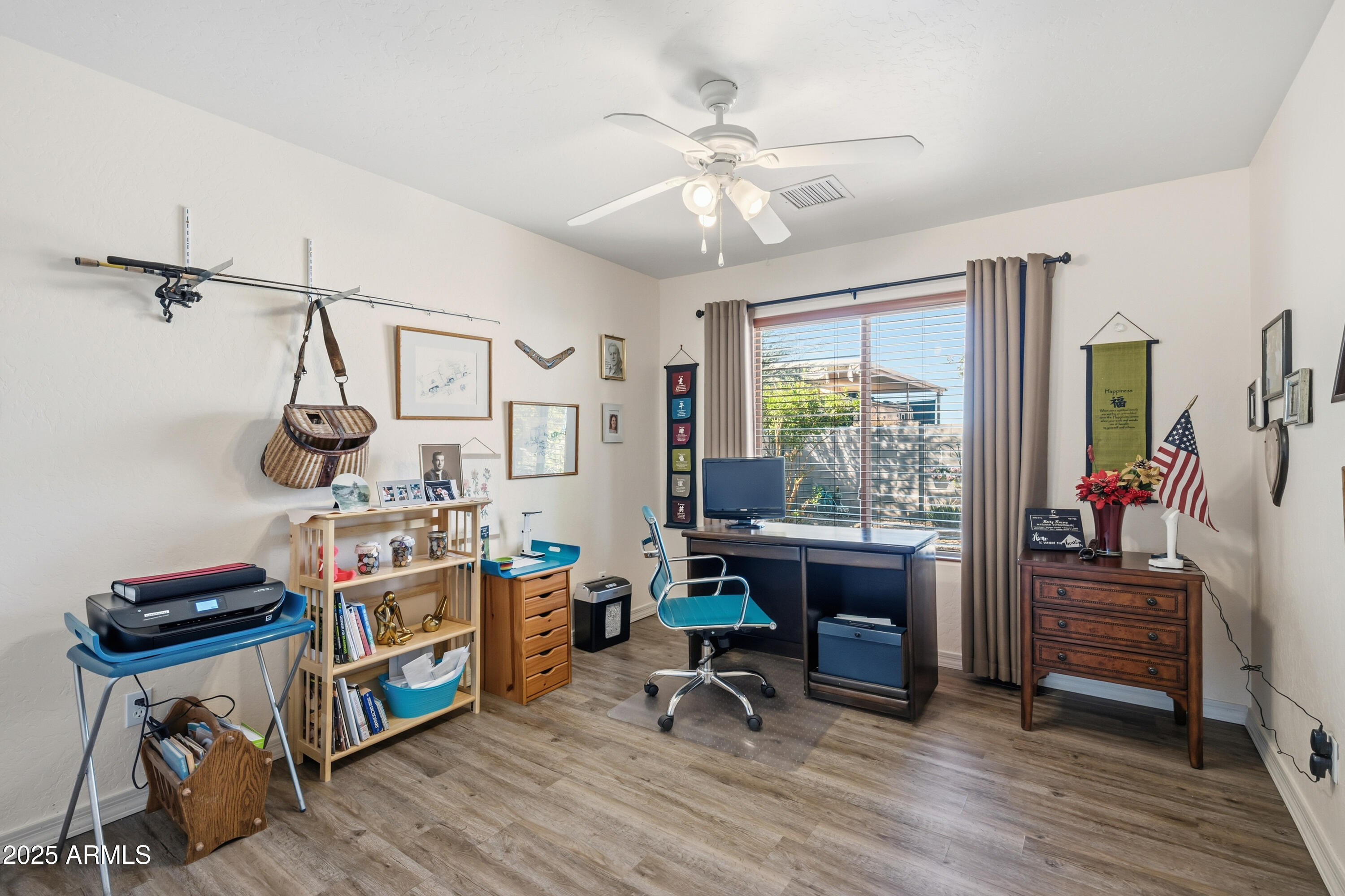 14844 South Brook Hollow Road Arizona City, AZ 85123 - Photo 17 of 35 a view of a workspace with furniture and a window
