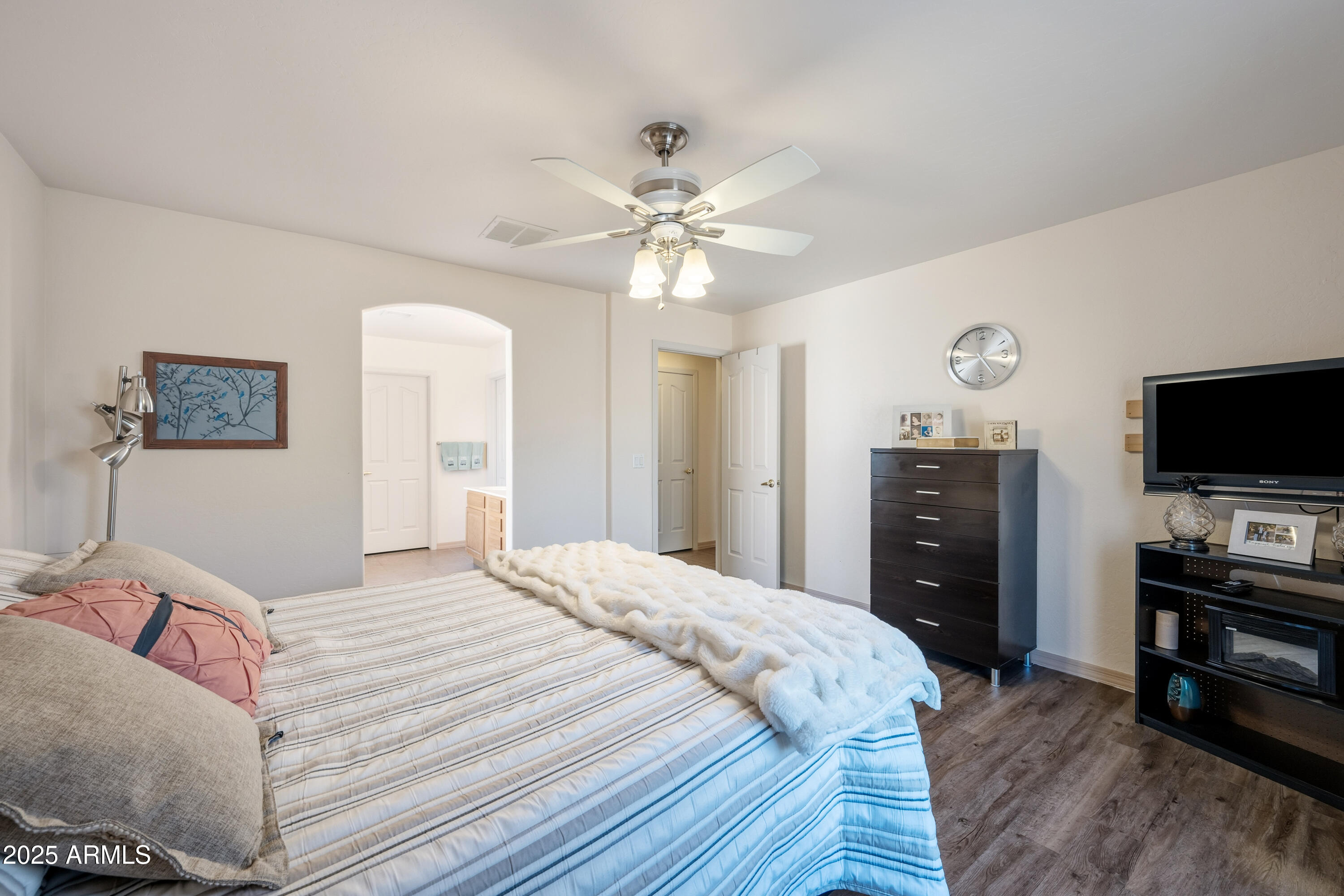 14844 South Brook Hollow Road Arizona City, AZ 85123 - Photo 20 of 35 a bedroom with a bed and a flat screen tv