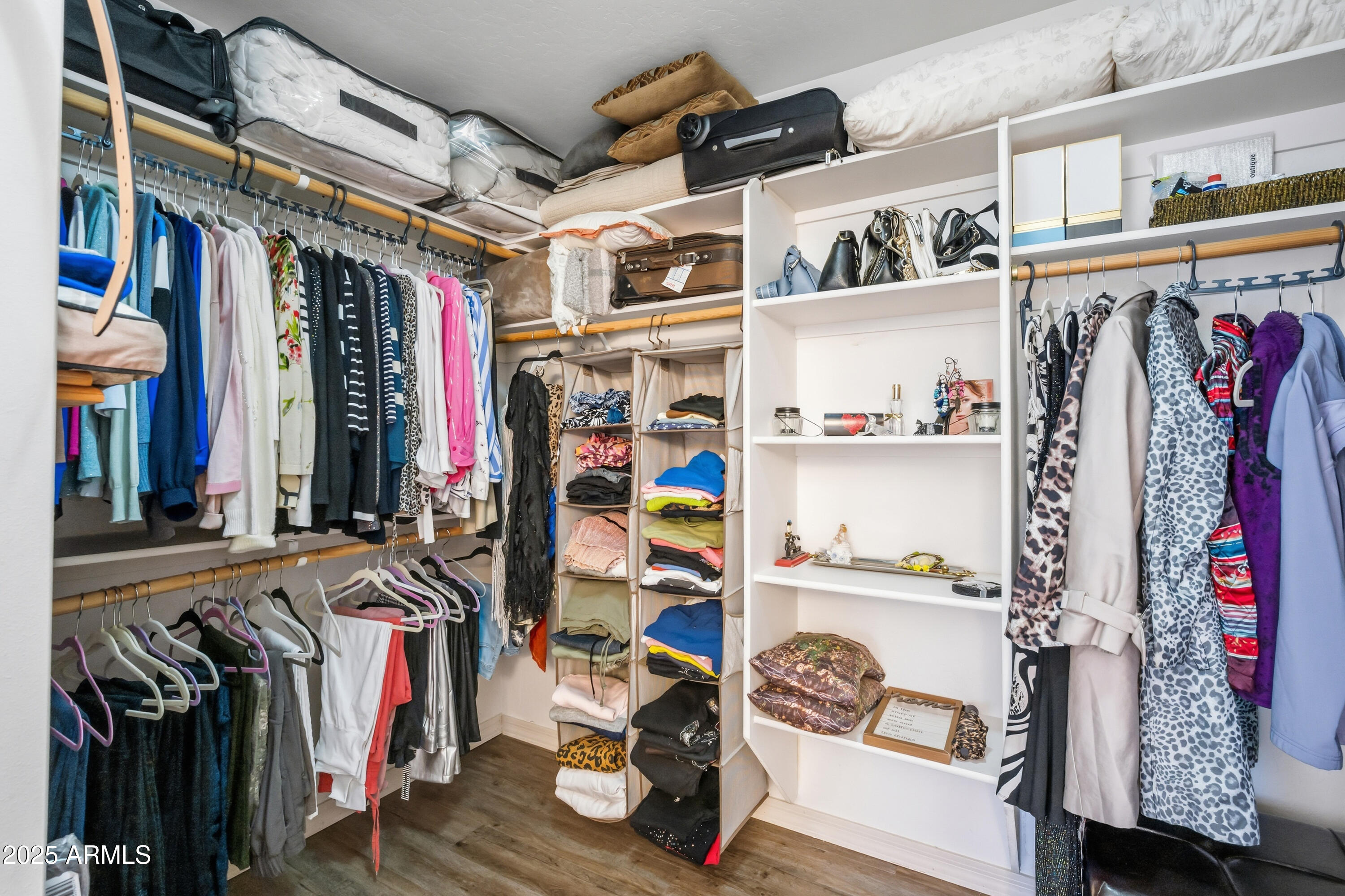 14844 South Brook Hollow Road Arizona City, AZ 85123 - Photo 24 of 35 a view of walk in closet with clothes and shoes