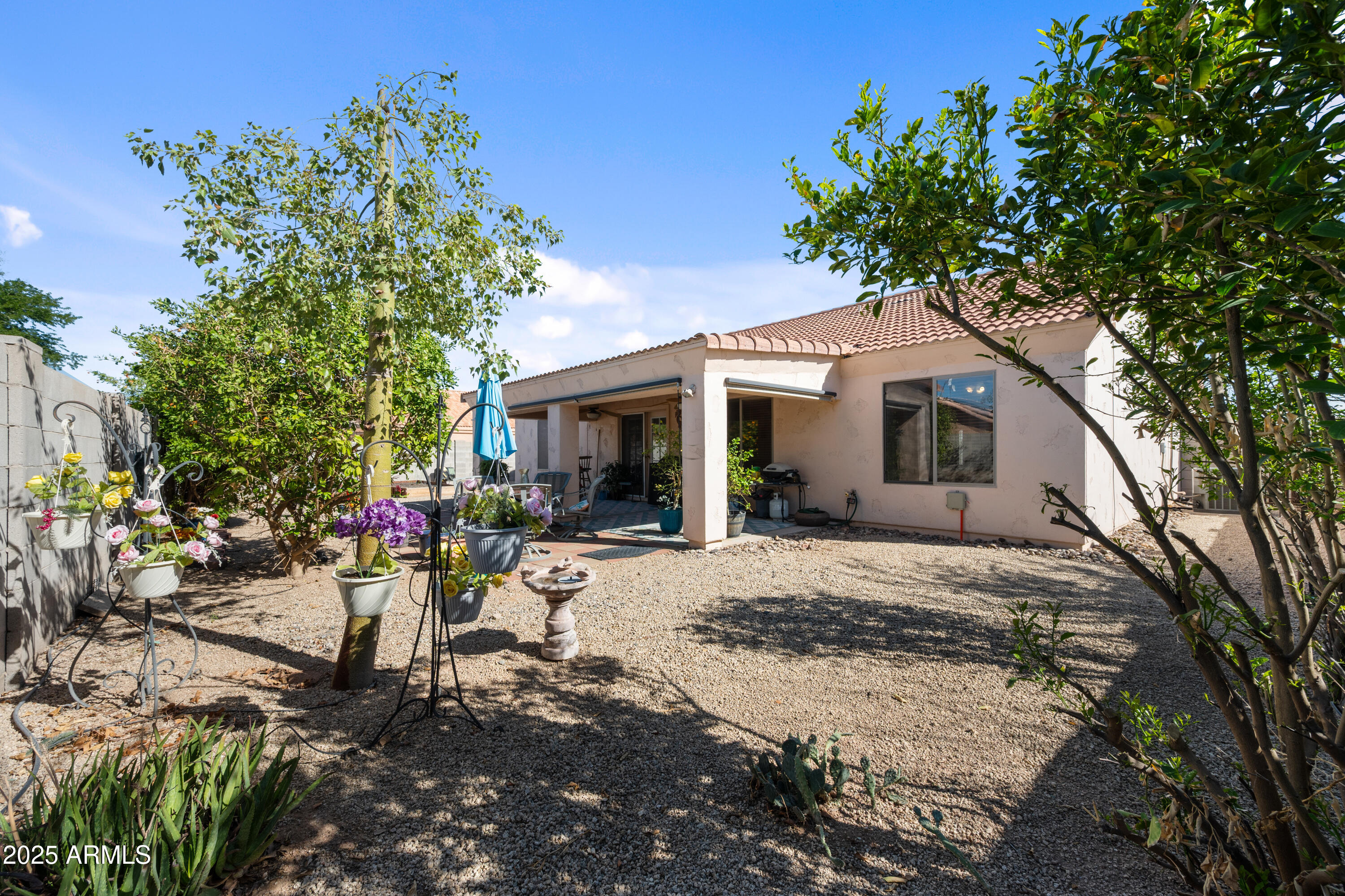 14844 South Brook Hollow Road Arizona City, AZ 85123 - Photo 32 of 35 a front view of a house with a patio