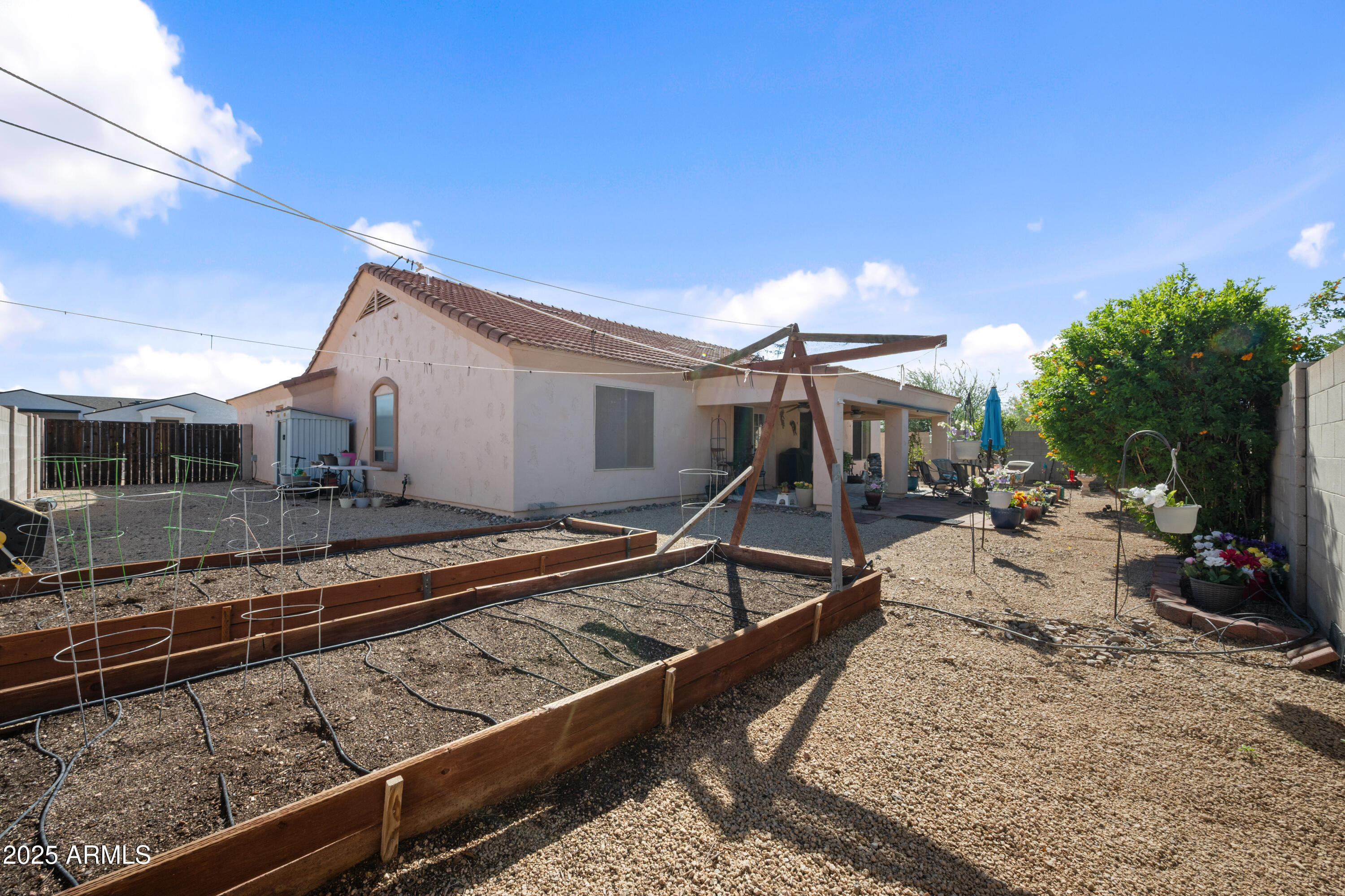 14844 South Brook Hollow Road Arizona City, AZ 85123 - Photo 33 of 35 a view of a backyard with sitting area
