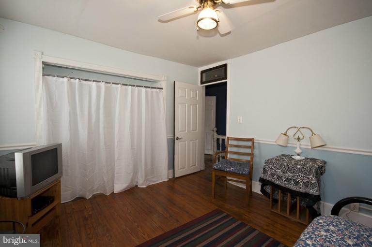 4539 Schenley Road Baltimore, MD 21210 - Photo 22 of 25 a bedroom with furniture and a window