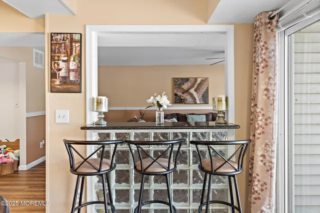 a kitchen with a table and chairs in it