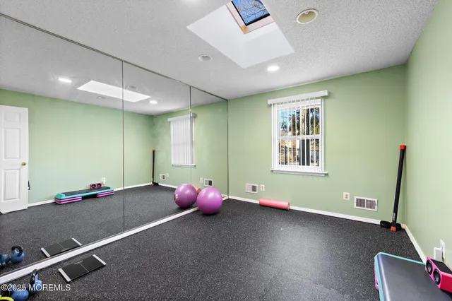 a bedroom with furniture and a window