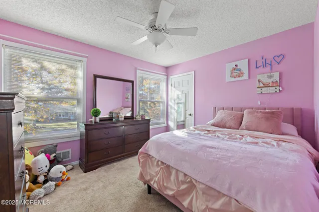 a bed room with a bed and a window