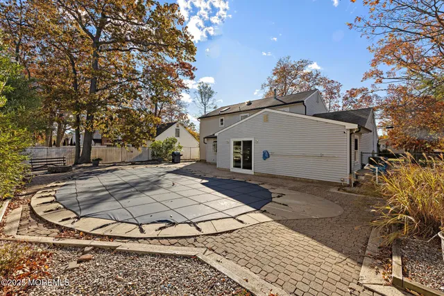 a view of a white house with a yard