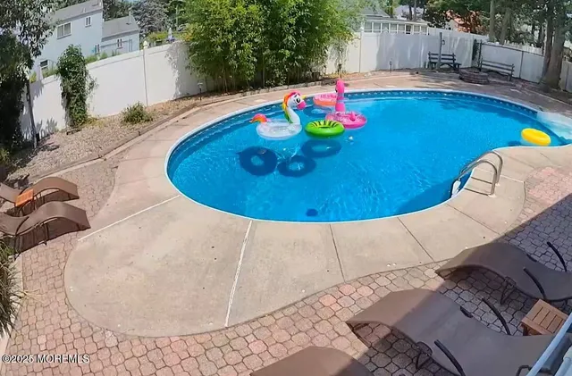 an aerial view of a swimming pool