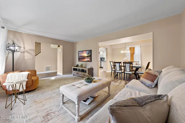 a living room with furniture and a table