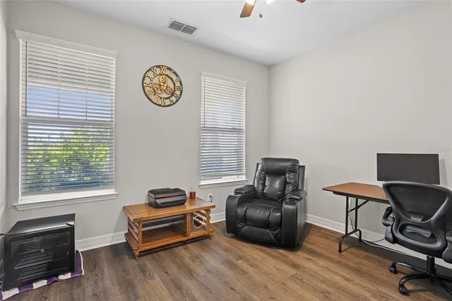 an empty room with windows and pillars in it
