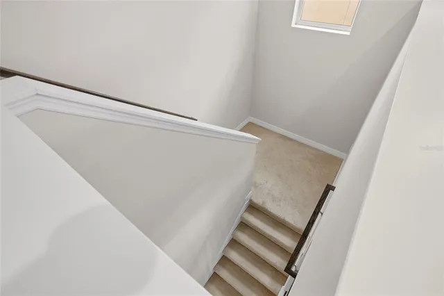 a large bathroom with a large mirror vanity and shower