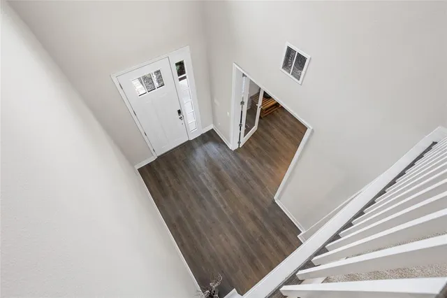 a bathroom with a shower and a glass door