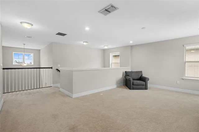 a view of walk in closet with clothes