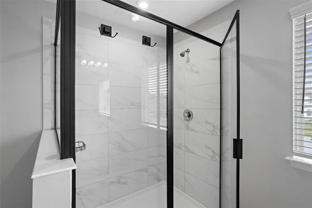 a room with gym equipment and a large window