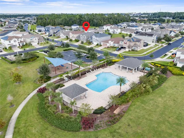 an aerial view of a house with garden space and outdoor space