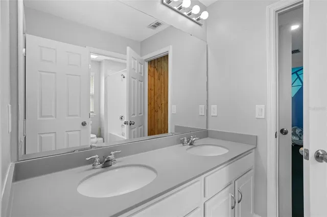 an aerial view of residential houses with outdoor space and city view