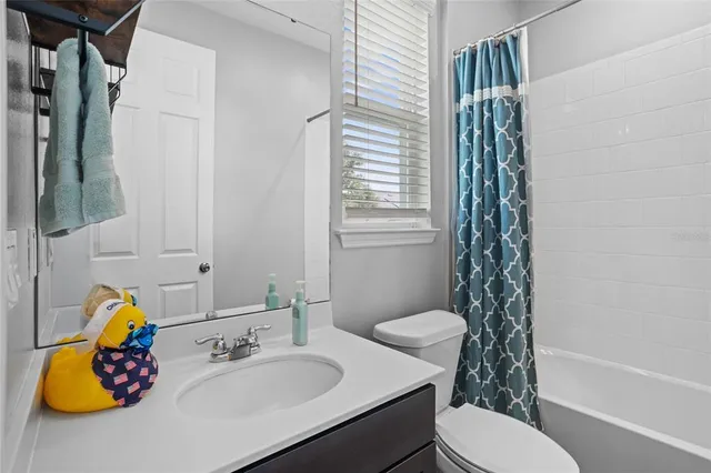 an aerial view of a house with outdoor space