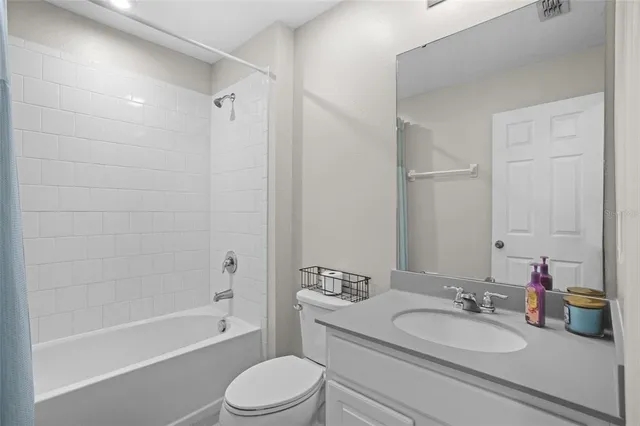 an aerial view of a house with a yard and lake view