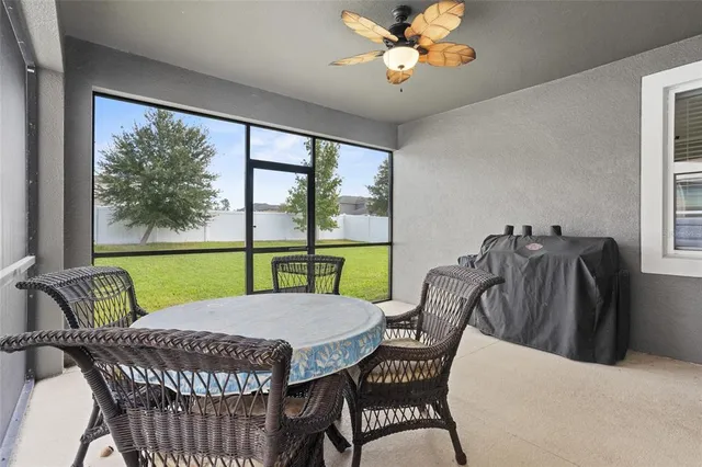 an aerial view of a house with a garden and lake view