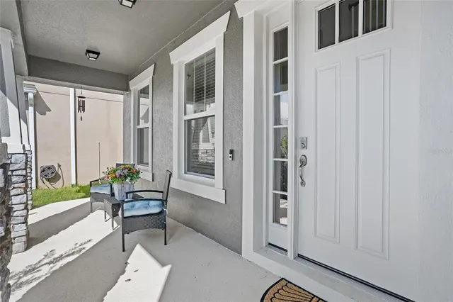 a view of a hallway with wooden floor and entryway