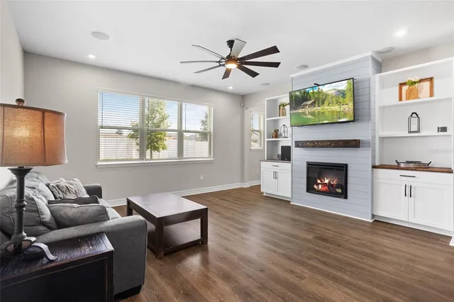 a kitchen with a kitchen island a sink stove and wooden floor