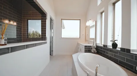 a bathroom with a bathtub and shower