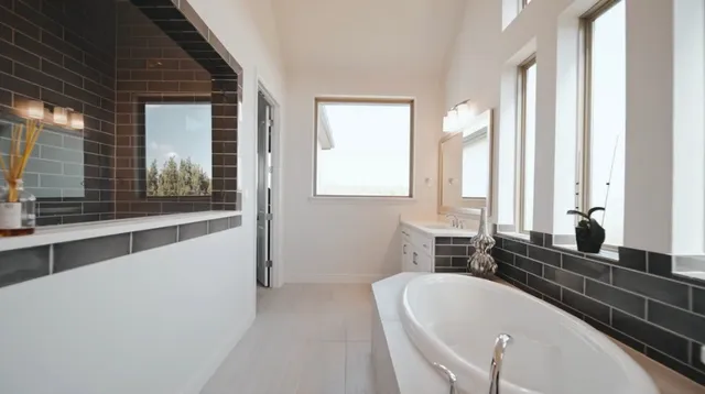 a bathroom with a bathtub and shower
