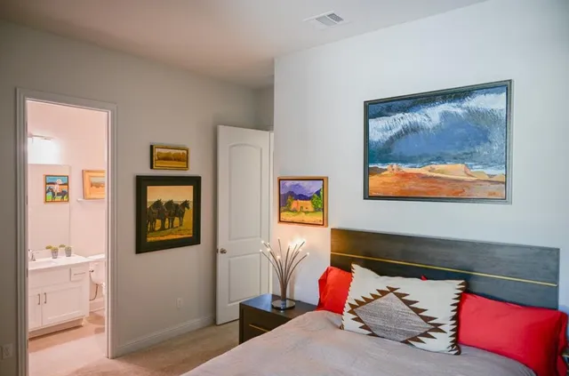 an aerial view of a house with a yard and lake view