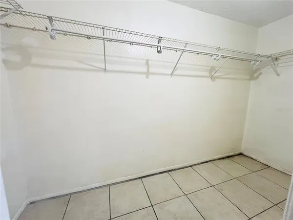 a bathroom with a granite countertop sink toilet and mirror