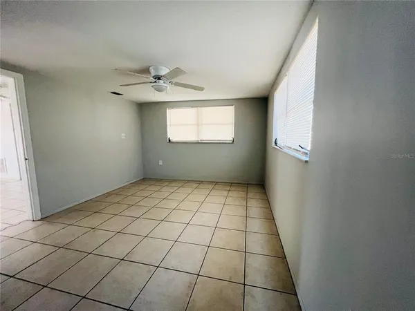 a view of an empty room and window